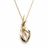 A gold necklace with a stylized flame-shaped pendant, shown against a plain white background.
